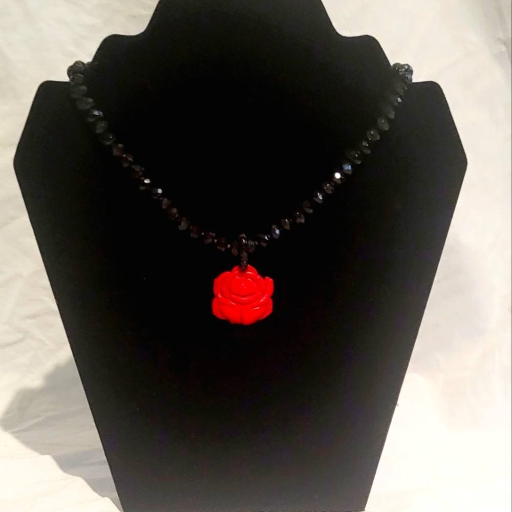 Beautiful beaded necklace with a red rose